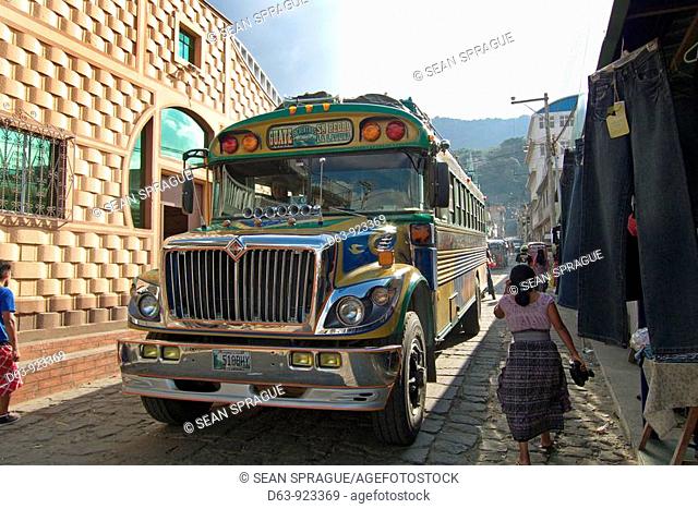 Street with Guatemalan 'chicken bus', San Pedro La Laguna, Guatemala