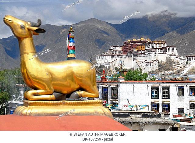 Golden deer figure Jokhang Temple with view to Potala Palace Lhasa Tibet China