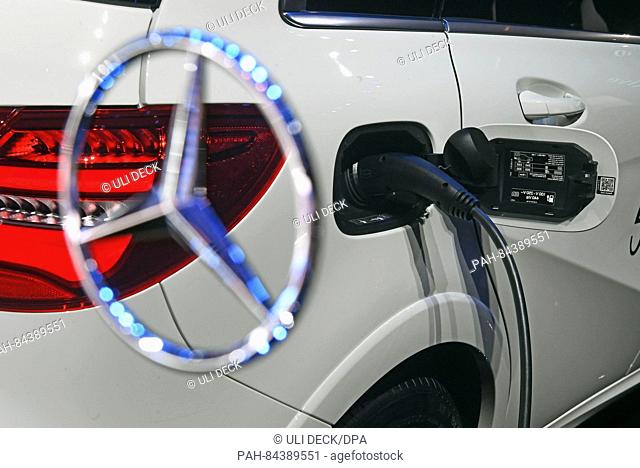 The charging plug of a fully electric Mercedes-Benz B 250 is reflected on a plastic surface during the second press day the Paris Motor Show (Mondial de...