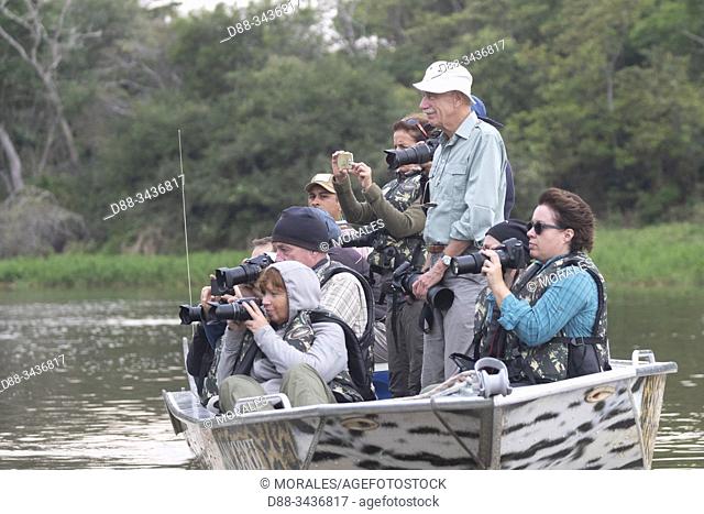 Brazil, Mato Grosso, Pantanal area, tourists on the river Cuiaba