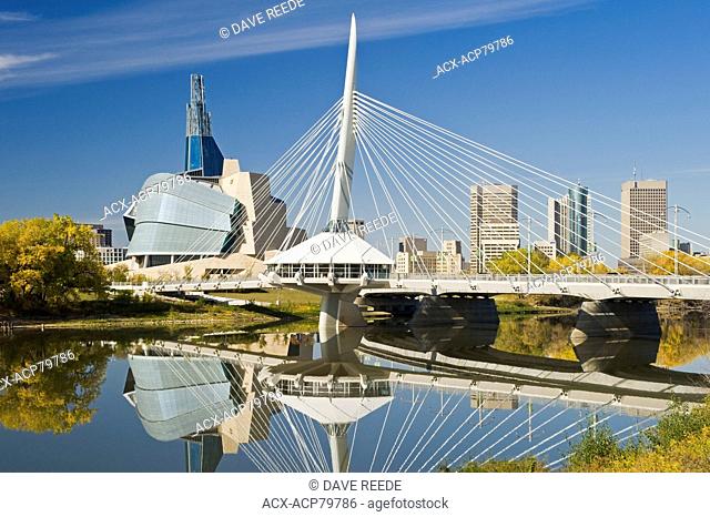 Winnipeg skyline from St. Boniface showing the Red River, Esplanade Riel Bridge and Canadian Museum for Human Rights, Manitoba, Canada