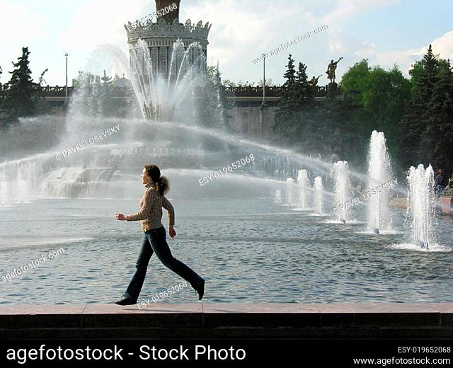 running girl at fountain