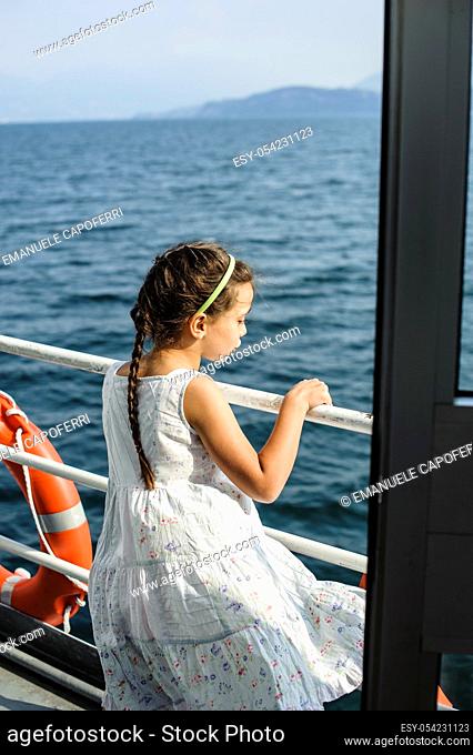 Children navigate on the steamer on Lake Maggiore, Italy