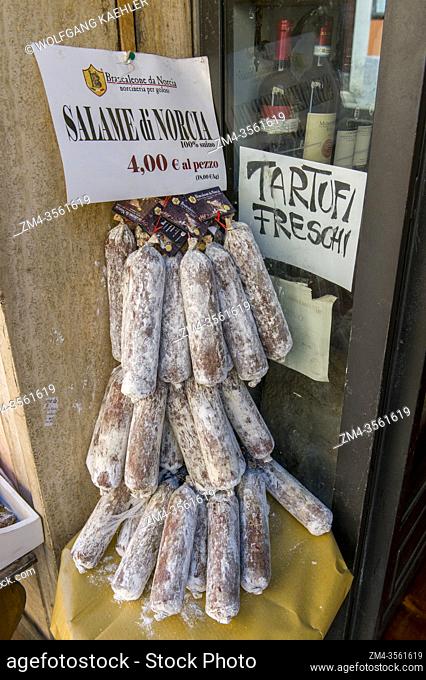 Display of ham and sausages at a butcher shop in the town of Norcia in the province of Perugia in southeastern Umbria, Italy