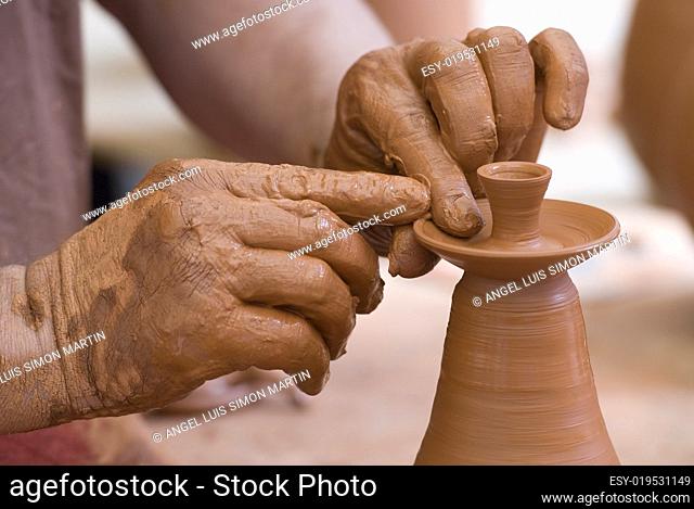 Potter working with clay