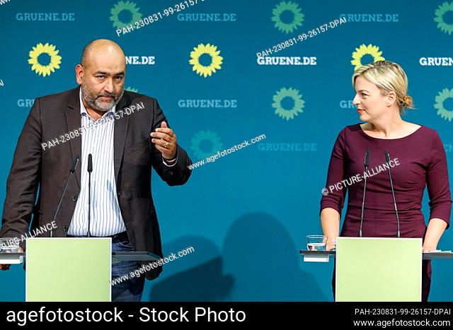 31 August 2023, Bavaria, Nuremberg: Omid Nouripour, federal chairman of Bündnis 90/Die Grünen, speaks next to Katharina Schulze