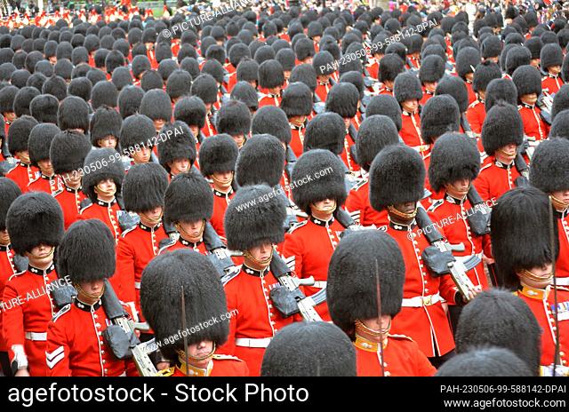 06 May 2023, Great Britain, London: Members of the royal bodyguard move in procession to Buckingham Palace after the coronation ceremony