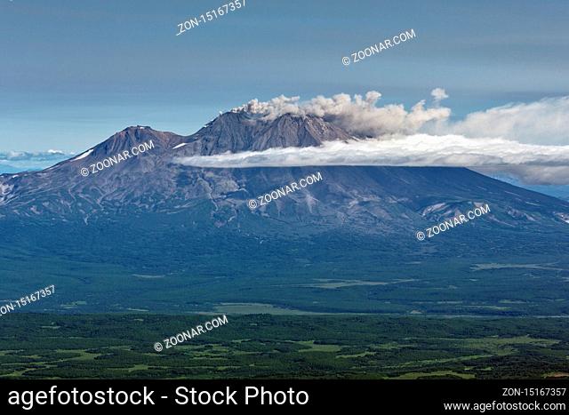 Beautiful mountain landscape of Kamchatka Peninsula: eruption active Zhupanovsky Volcano in explosion of magmatic gases, accompanied by release of crater of...