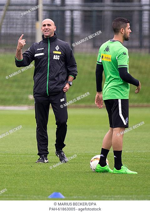 Moenchengladbach's caretaker coach Andre Schubert (L) instructs his players during a training session of German Bundesliga soccer club Borussia Moenchengladbach...
