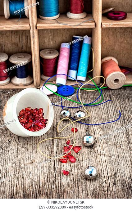 different tools for needlework beading and sewing in vintage style.Selective focus