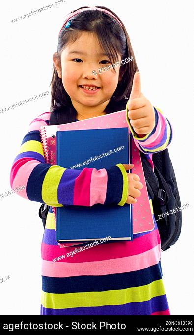 Friendly little Asian student making thumbs up sign, Isolated over white