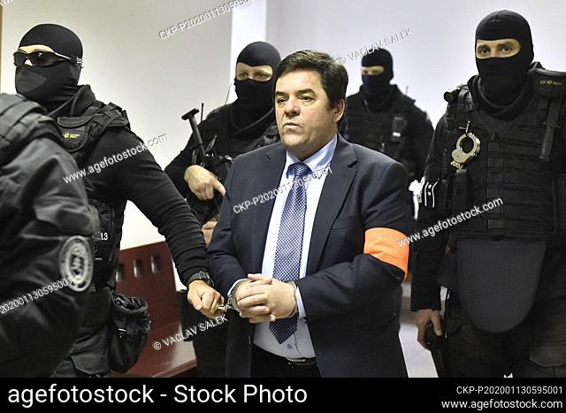 The heavily armed members of Prison Service bring Marian Kocner into a courtroom ahead of the trial in Pezinok, Slovakia, on Monday, January 13, 2020