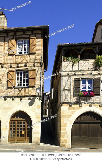 Quaint old buildings with colourful shutters in the streets and squares of Figeac, Lot 46, France, Europe