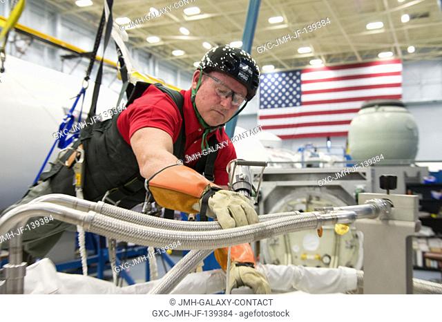 NASA astronaut Barry Wilmore, Expedition 41 flight engineer and Expedition 42 commander, participates in an extravehicular activity (EVA) training session in...