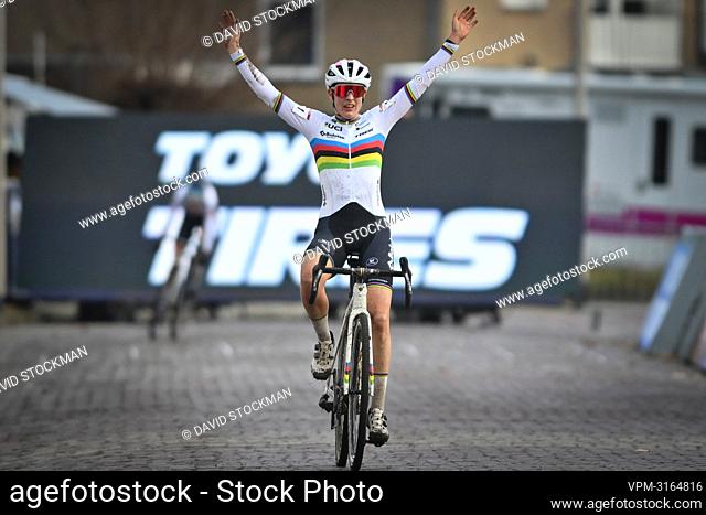 Dutch Lucinda Brand celebrates as she crosses the finish line to win the women's elite race of the 'Vestingcross' cyclocross cycling event