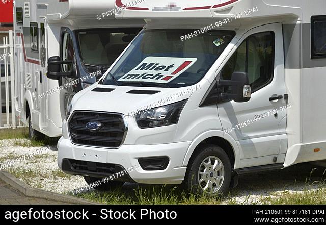 20 May 2021, Saxony, Leipzig: ""Rent me!"" prompts a sign in a motorhome in front of a motorhome rental in Leipzig. Demand for both rental motorhomes and...