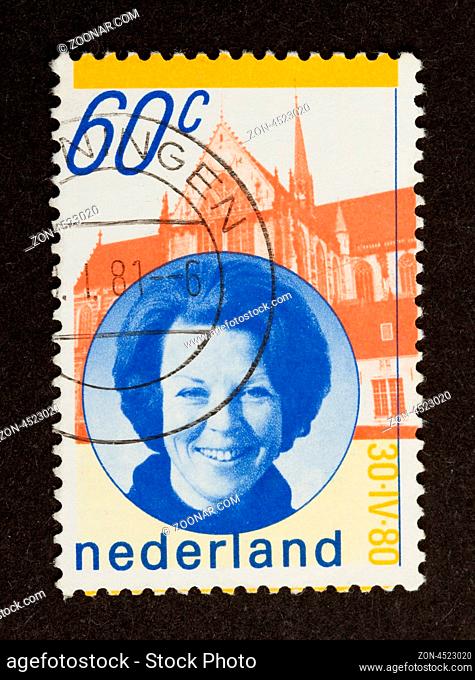 HOLLAND - CIRCA 1980: Stamp printed in the Netherlands shows a picture of the dutch queen (Beatrix), circa 1980