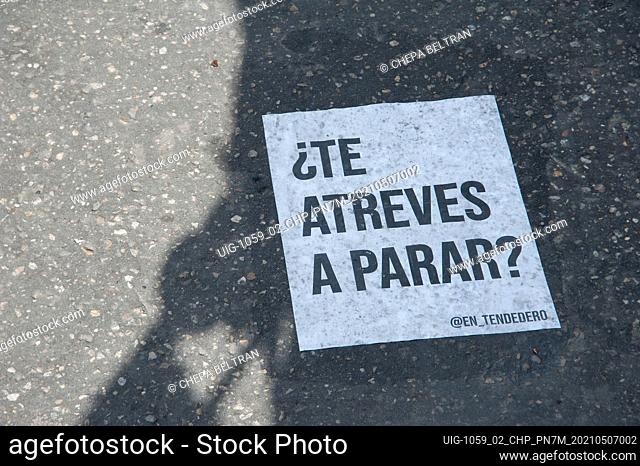 Signs left on the street calling citizens to action in Bogota, Colombia on May 7 2021 after peaceful demonstrators against the tax and health reform of...