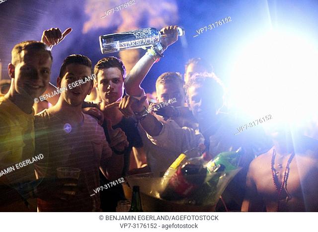 party people holding Belvedere Vodka bottle at music festival Starbeach Chersonissos, Crete, Greece, at 06. August 2018