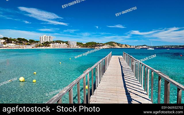 Empty wooden boardwalk leading to Mediterranean Sea clear green lagoon bay waters, freedom, vacation, free time, summer holidays concept, Palma de Majorca