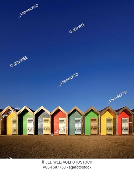 Colourful beach huts along the seafront promenade at Blyth, Northumberland, England