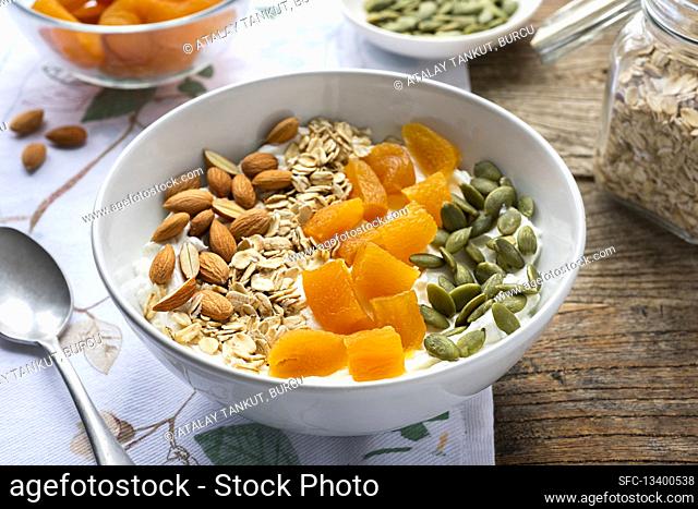 Muesli with fried apricots, almonds and pistachios