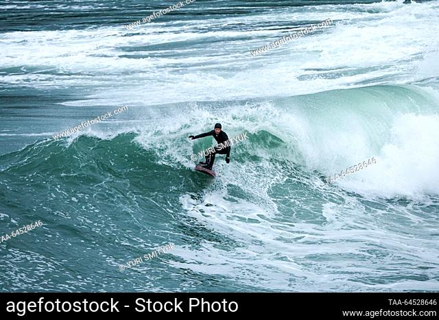 RUSSIA, VLADIVOSTOK - NOVEMBER 7, 2023: A surfer rides a wave during the Cold Water Cup surfing tournament in the Chernyshev Bay off Russky Island