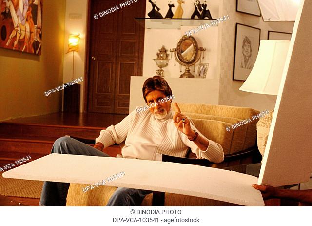 South Asian Indian Bollywood film star Amitabh Bachchan shooting for ad film in Mehboob studio ; Bombay Mumbai ; Maharashtra ; India