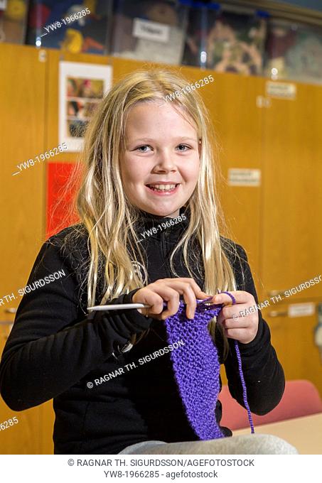 Young girl learning to knit in school, Reykjavik, Iceland