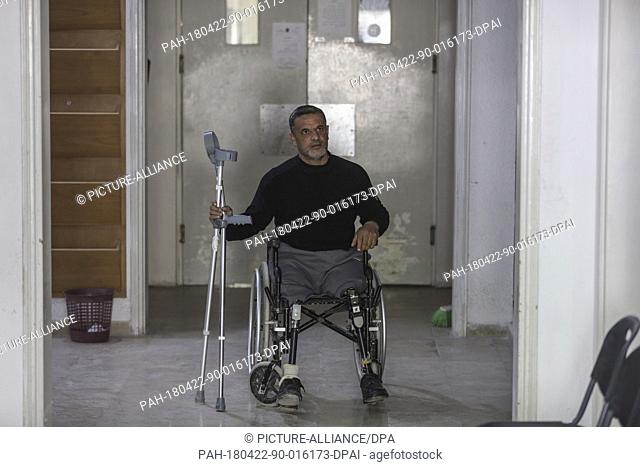 A Palestinian man with prosthetic legs on a wheelchair pictured at Gaza's Artificial Limbs and Polio Centre (ALPC), in Gaza City, 22 April 2018