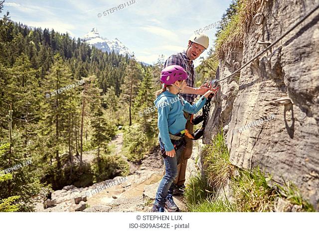 Father and child rock climbing, Ehrwald, Tyrol, Austria