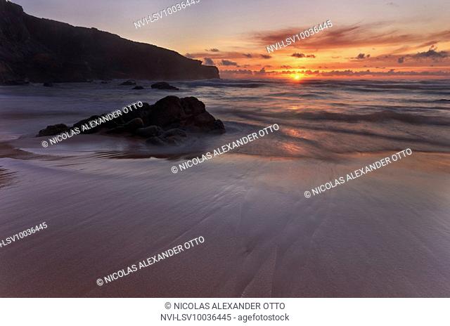 Sunset on Praia do Malhao beach, Vila Nova de Milfontes, Portugal
