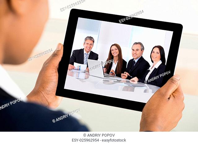 Close-up Of A Businesswoman Video Conferencing On Digital Tablet