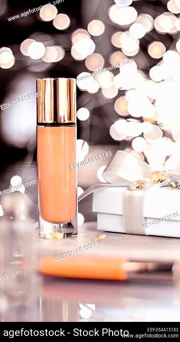Cosmetic branding, Christmas glitter and girly blog concept - Holiday make-up foundation base, concealer and white gift box