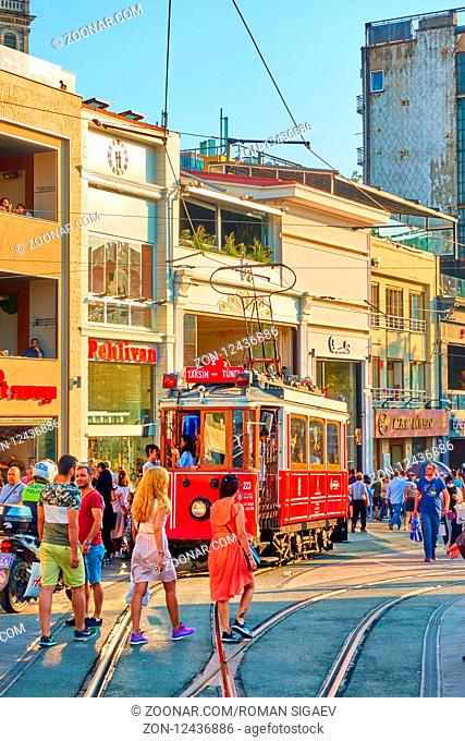 Istanbul, Turkey - July 18, 2018: Historic tram and walking people in Istiklal pedestrian street in Istanbul