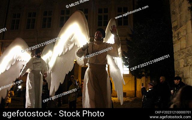Giant angels on stilts are walking through Prague's city center, Czech Republic, December 9, 2023. Angels wishing people a happy Advent and a merry Christmas