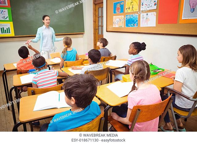 Pupils listening to teacher during class