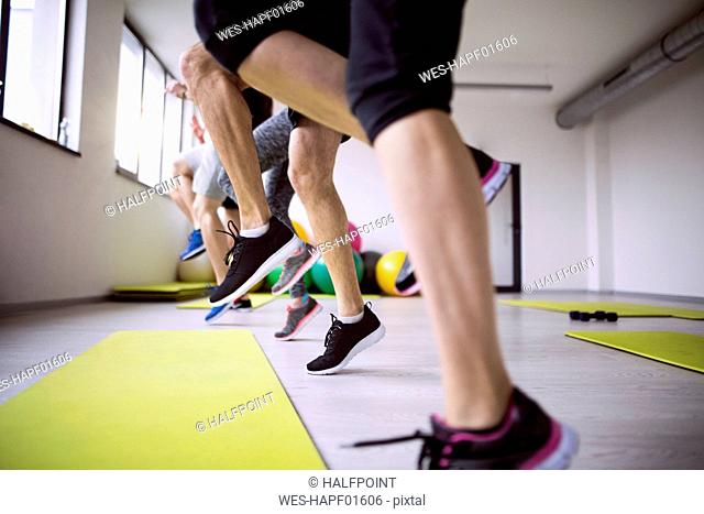 Group of athletes exercising in gym