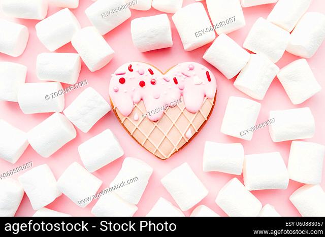Melt ice cream heart gingerbread cookie, marshmallow. Valentine. Pink background. High quality photo