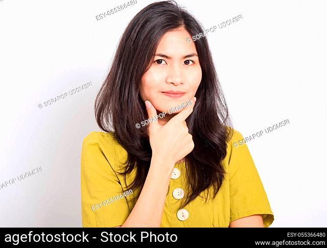 Portrait Asian beautiful young woman standing, She thinking or dreaming and looking to camera, shoot photo in studio on white background