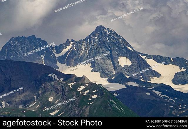 24 July 2021, Austria, Heiligenblut: The snow-covered summit of the Großglockner. The Großglockner is 3, 798 meters high and is therefore the highest mountain...