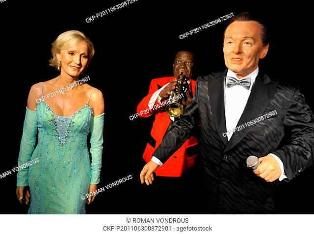 Wax figures of Helena Vondrackova (left to right), Louis Armstrong and Karel Gott are photographed in the Wax Museum Prague, Czech Republic, June 30, 2011