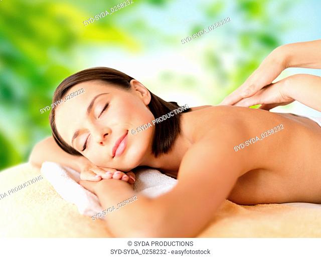 close up of beautiful woman having massage at spa