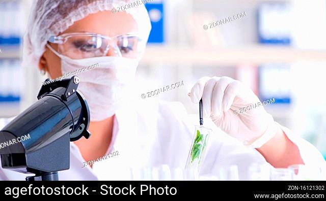 Female scientist researcher conducting an experiment in a laboratory