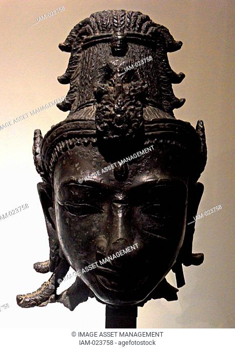 Head of Avalokitesvara around the 8th century in the style of My Son E1 Bronze. Vietnamese. Avalokitesvara 'Lord who looks down' is a bodhisattva who embodies...