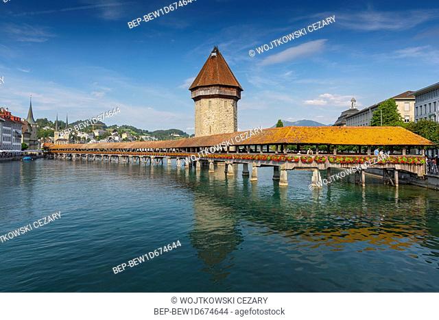 The famous Kapellbrucke (Chapel Bridge) wooden footbridge across the Reuss River in the city of Lucern, Switzerland