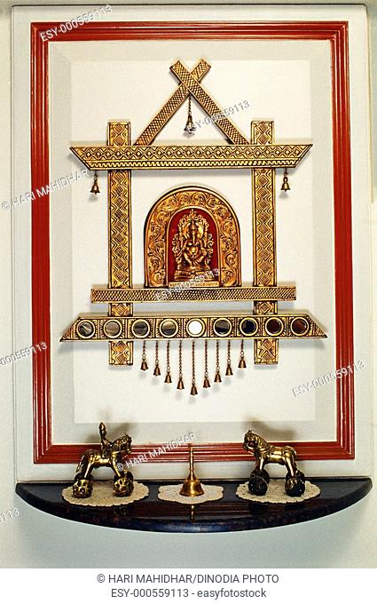 Ganesh idol with decoration in living room , India