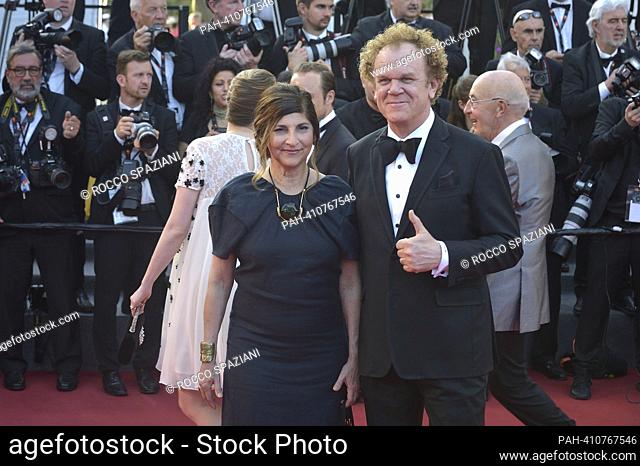CANNES, FRANCE - MAY 27:John C. Reilly and Alison Dickey poses with French actor Vincent Lacoste attends the ""Elemental"" screening and closing ceremony red...