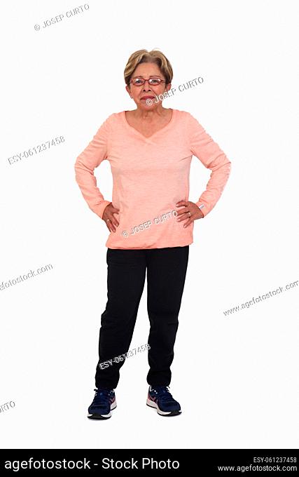 full portrait of happy woman with sportswear looking at camera hands on hip on white background