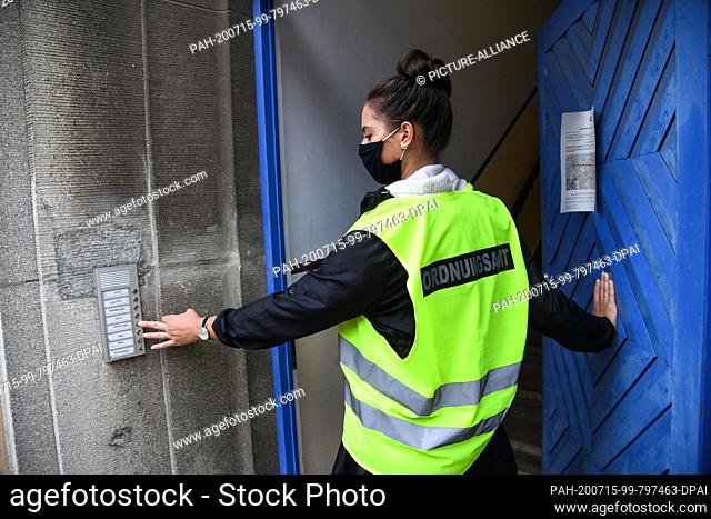 15 July 2020, Brandenburg, Potsdam: Employees of the city administration and the public order office check that the restricted area is maintained
